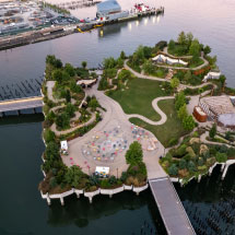 small man made island with green lawns and trees